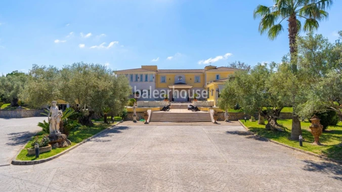 Impressive villa with noble architecture on a large plot of land surrounded by the green landscape.
