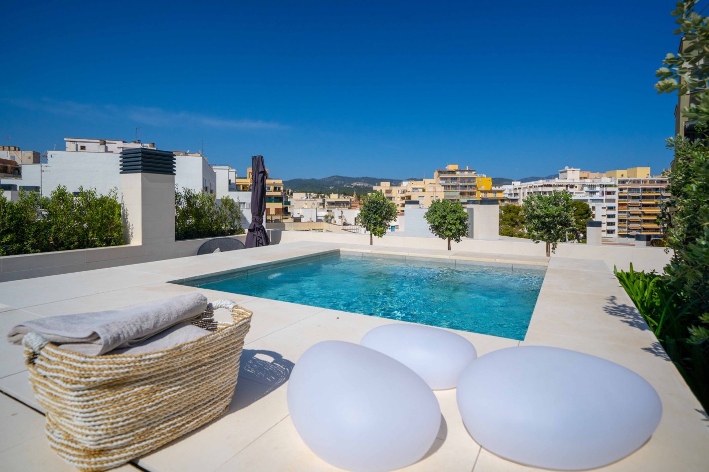 Modern south-facing penthouse in central Palma with rooftop terrace private pool and sea views.