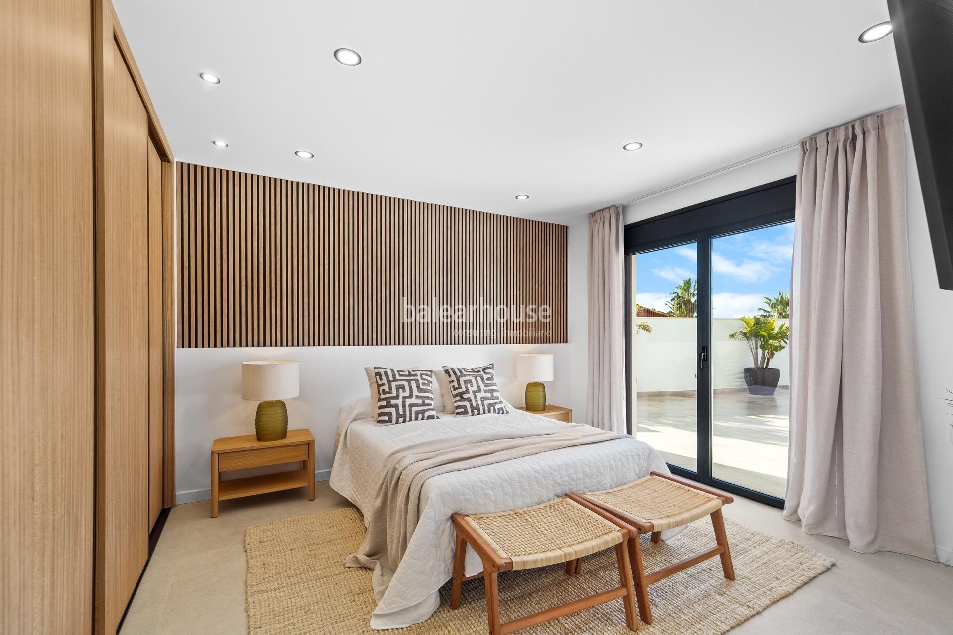 Moderna south facing villa with swimming pools and sea views next to the beach in Badía Blava