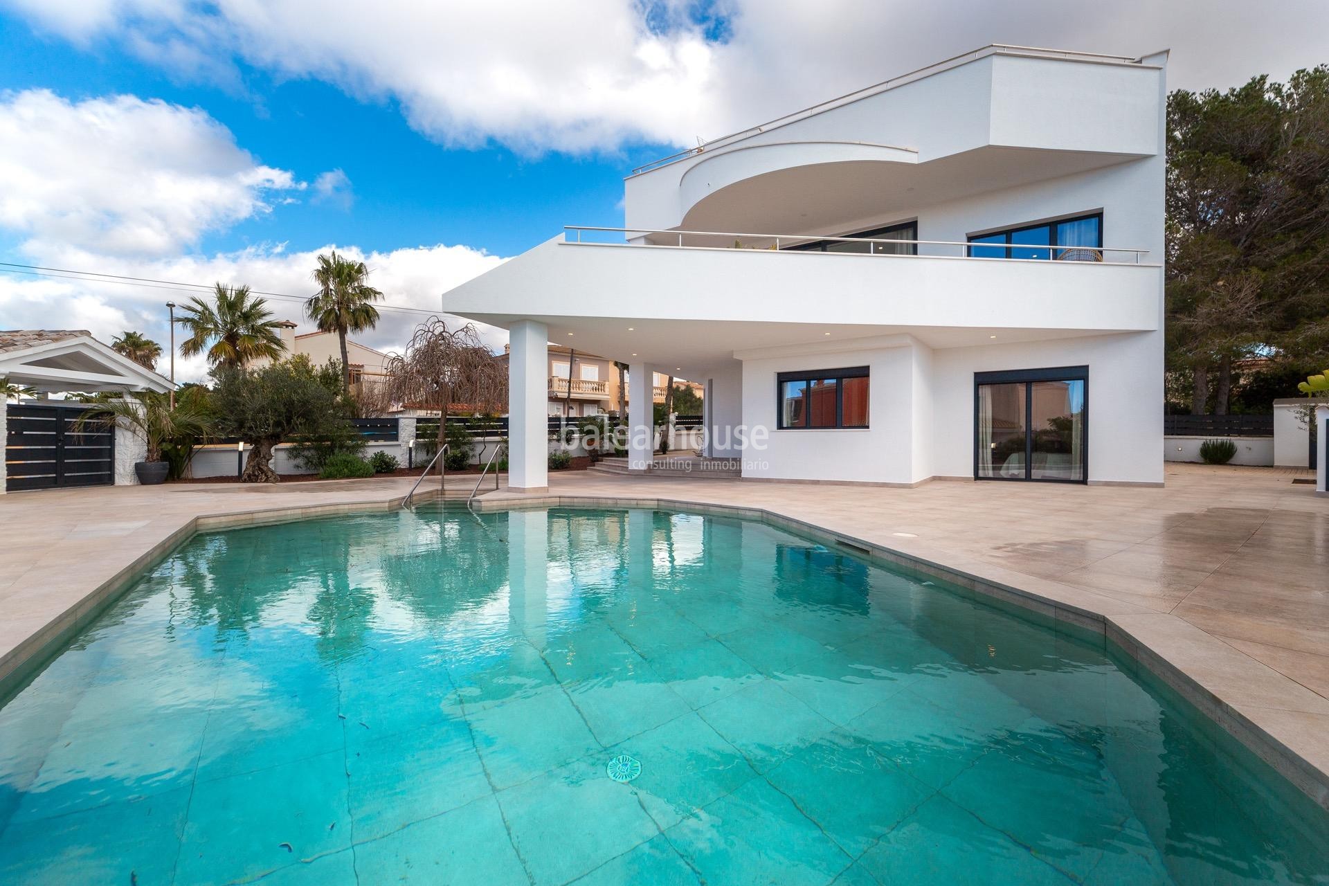 Moderna south facing villa with swimming pools and sea views next to the beach in Badía Blava