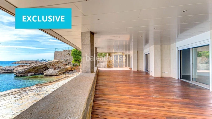 Exclusive seafront property with large terrace and direct private access to the sea.