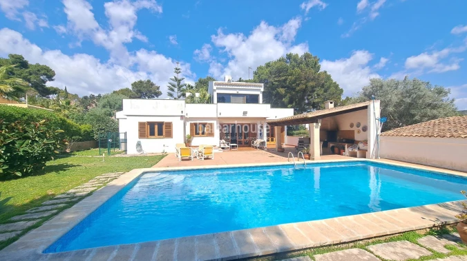 Mediterranean villa with expansive outdoor areas and lush woodland just steps from the Santa Ponsa Yacht Club