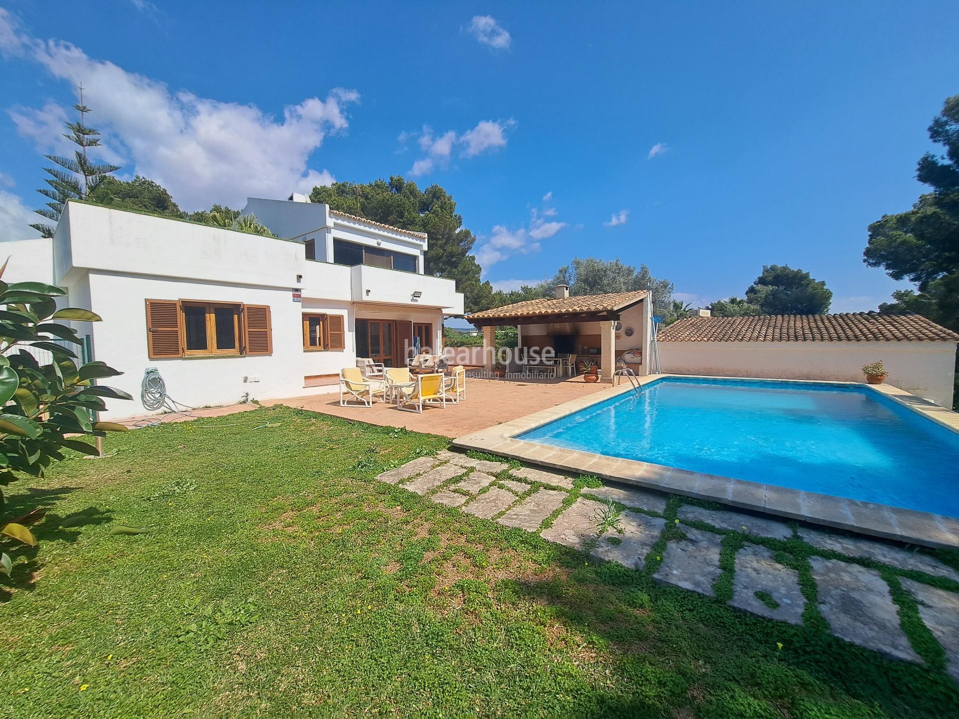 Mediterranean villa with expansive outdoor areas and lush woodland just steps from the Santa Ponsa Yacht Club
