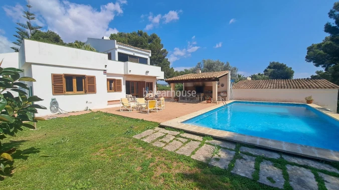 Mediterranean villa with expansive outdoor areas and lush woodland just steps from the Santa Ponsa Yacht Club
