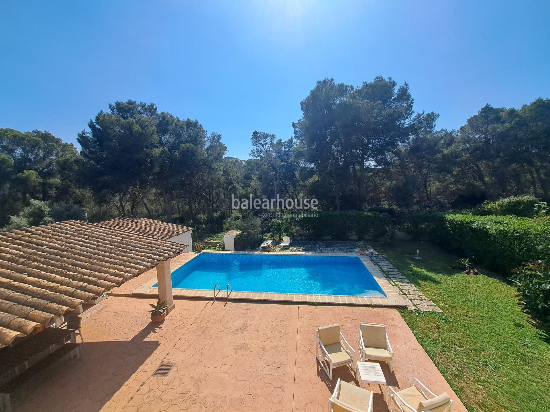 Mediterranean villa with expansive outdoor areas and lush woodland just steps from the Santa Ponsa Yacht Club