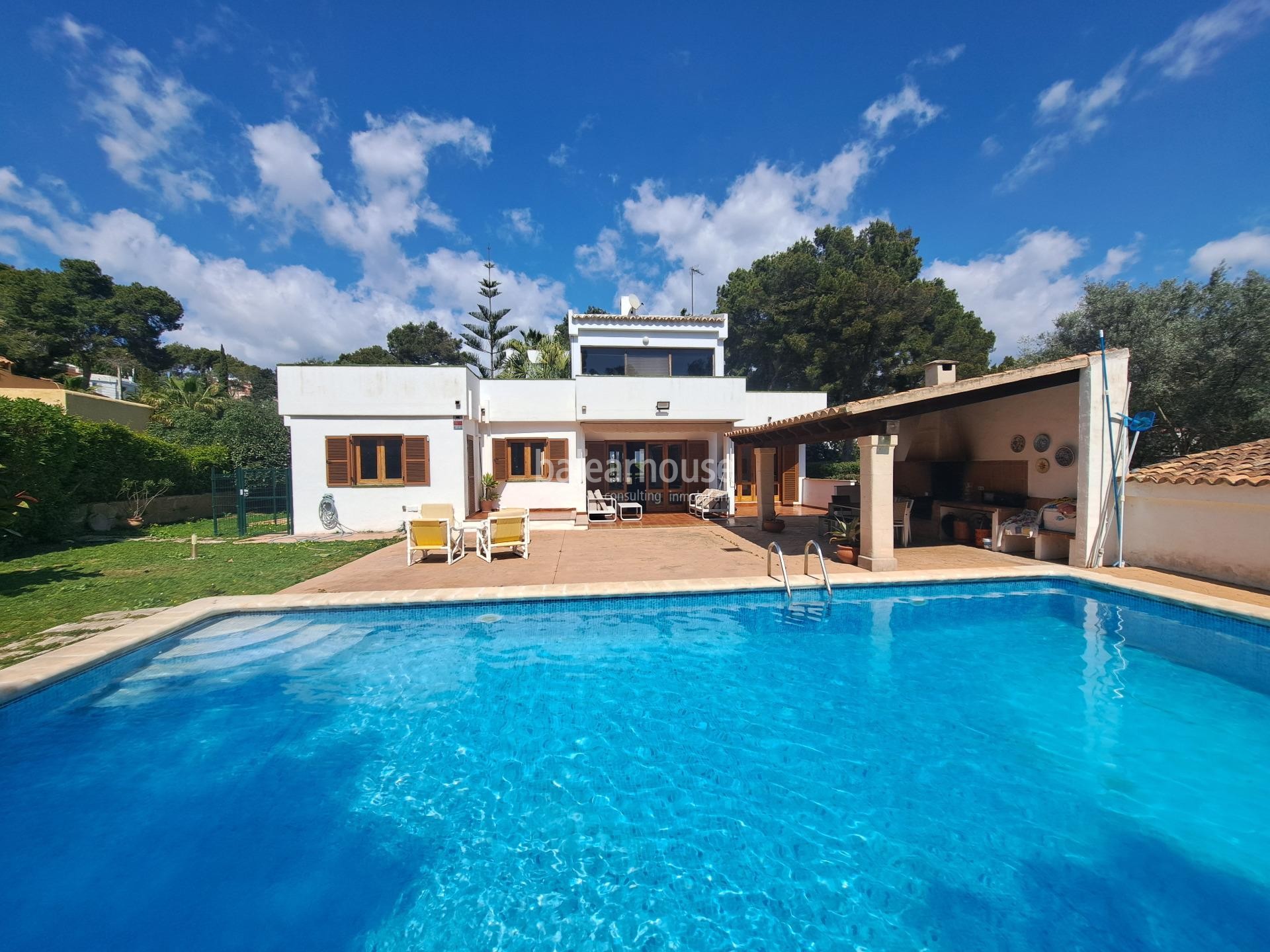 Mediterranean villa with expansive outdoor areas and lush woodland just steps from the Santa Ponsa Yacht Club