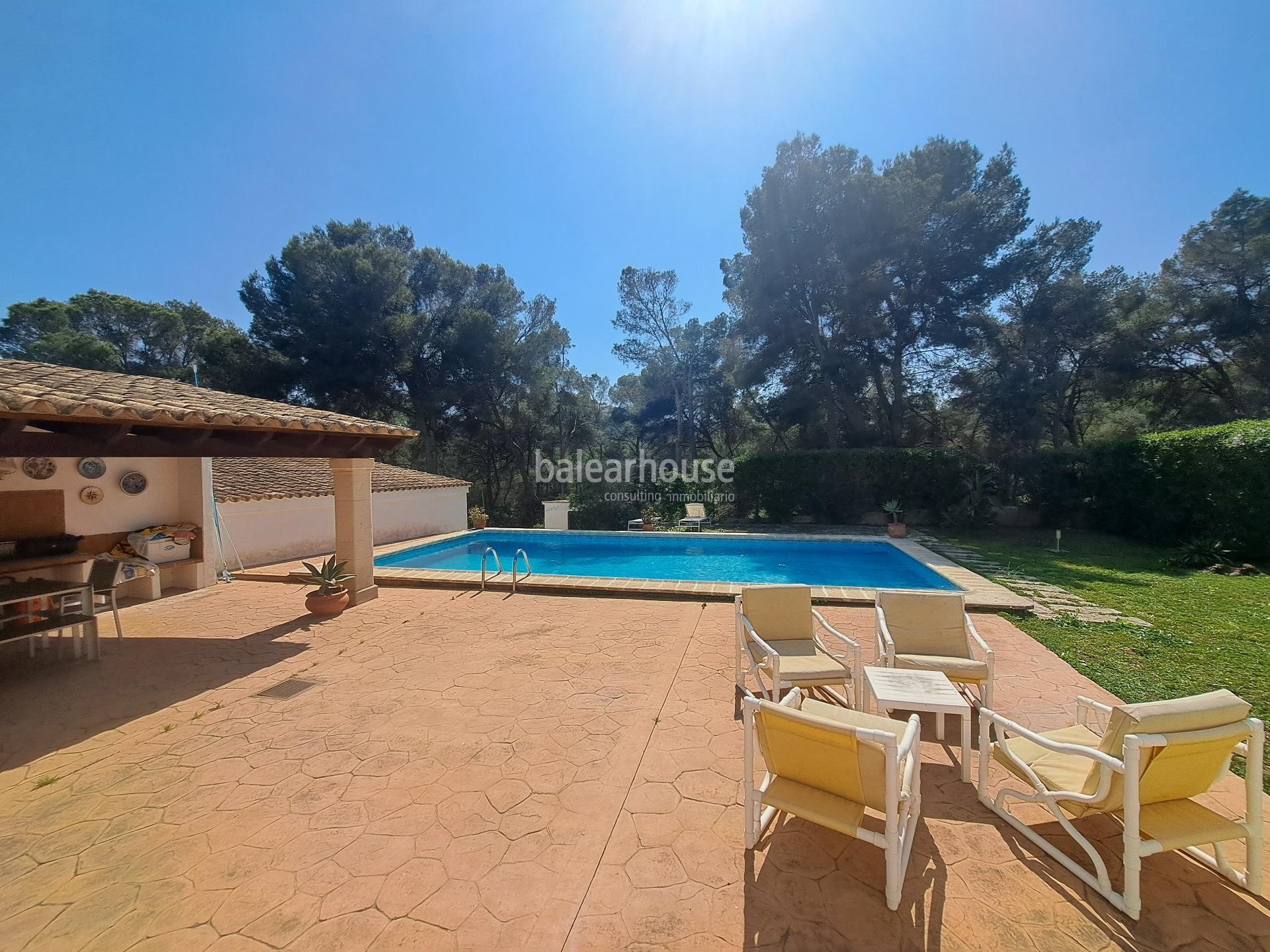 Mediterranean villa with expansive outdoor areas and lush woodland just steps from the Santa Ponsa Yacht Club