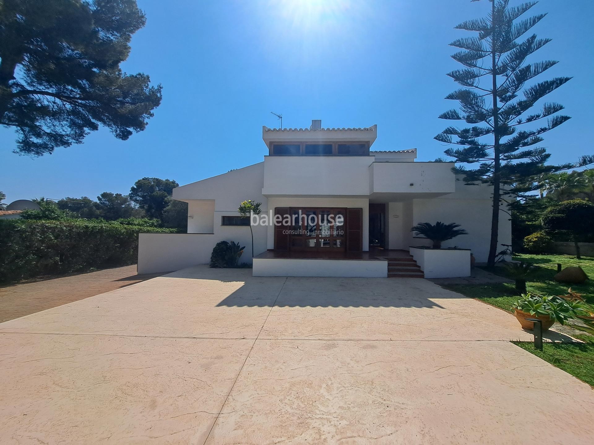 Mediterranean villa with expansive outdoor areas and lush woodland just steps from the Santa Ponsa Yacht Club